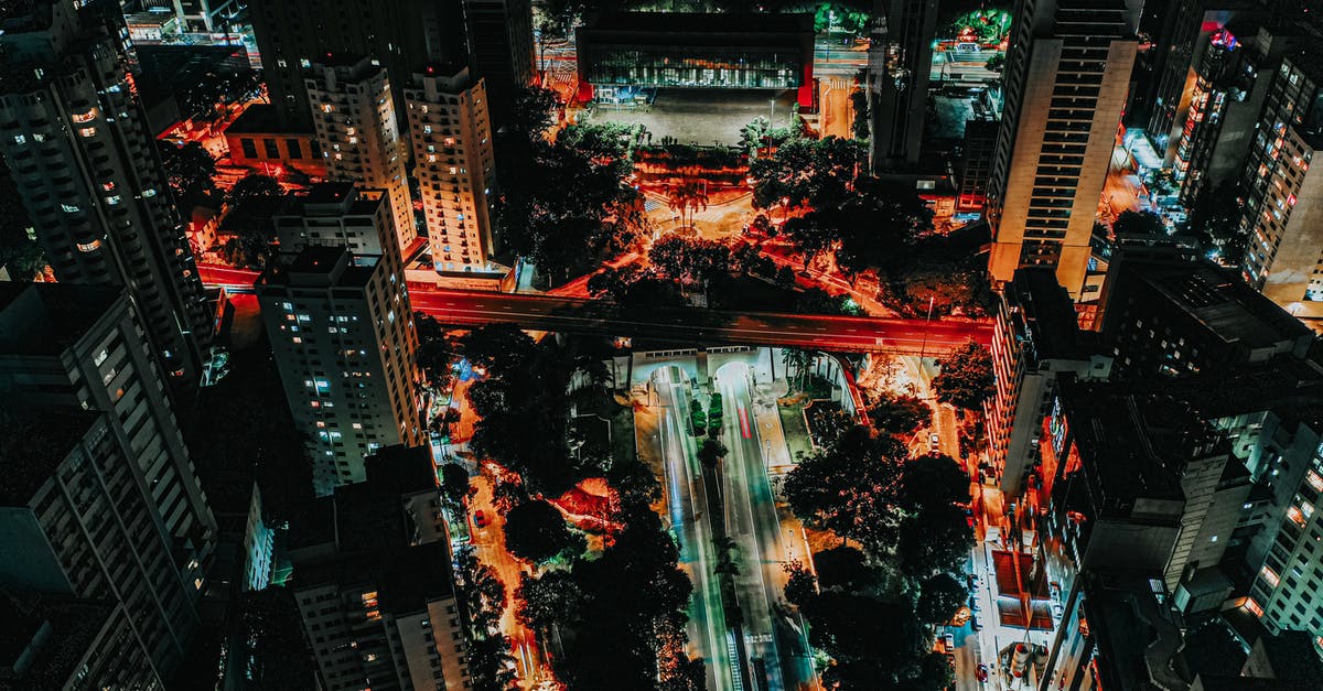 Vertigo Secret Level 3, is there any way to access the highlighted area? - Drone view of contemporary city streets surrounded by high buildings and trees at night time