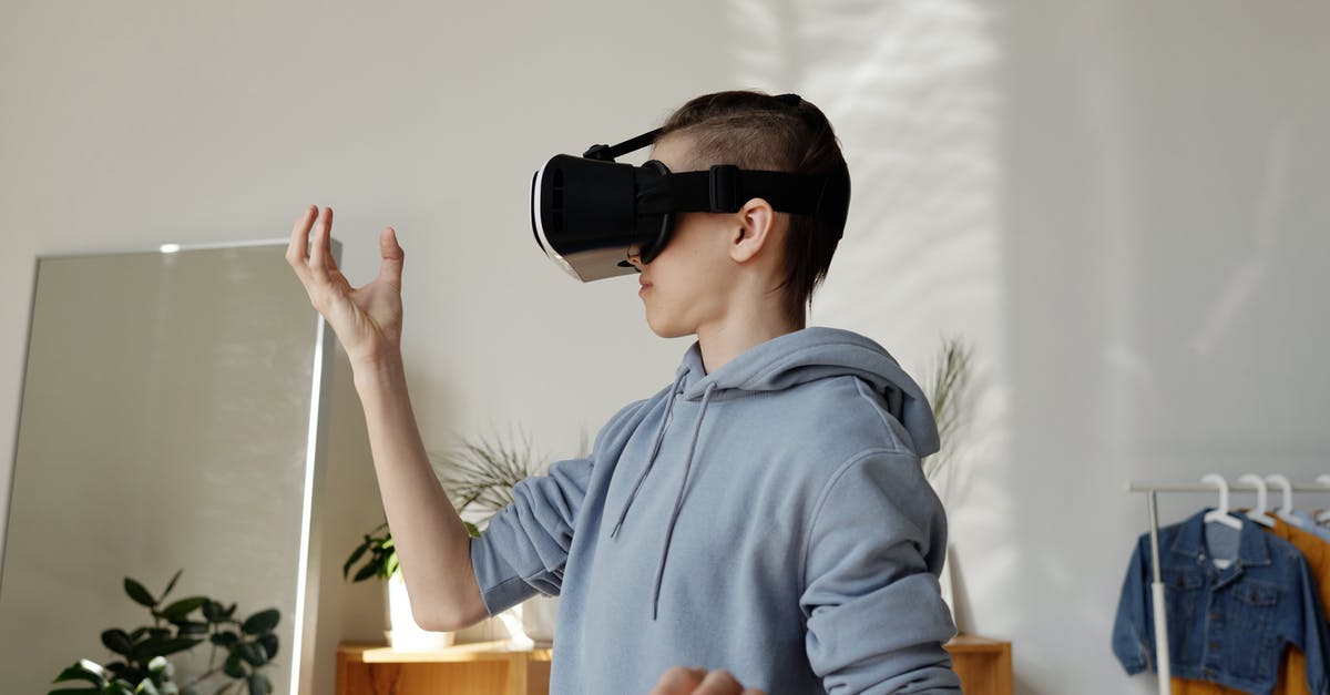 View jumping in VR games on Xperia Z3 compact - Boy in Gray Hoodie Wearing Vr Headset View jumping in VR games on Xperia Z3 compact - Boy in Gray Hoodie Wearing Vr Headset