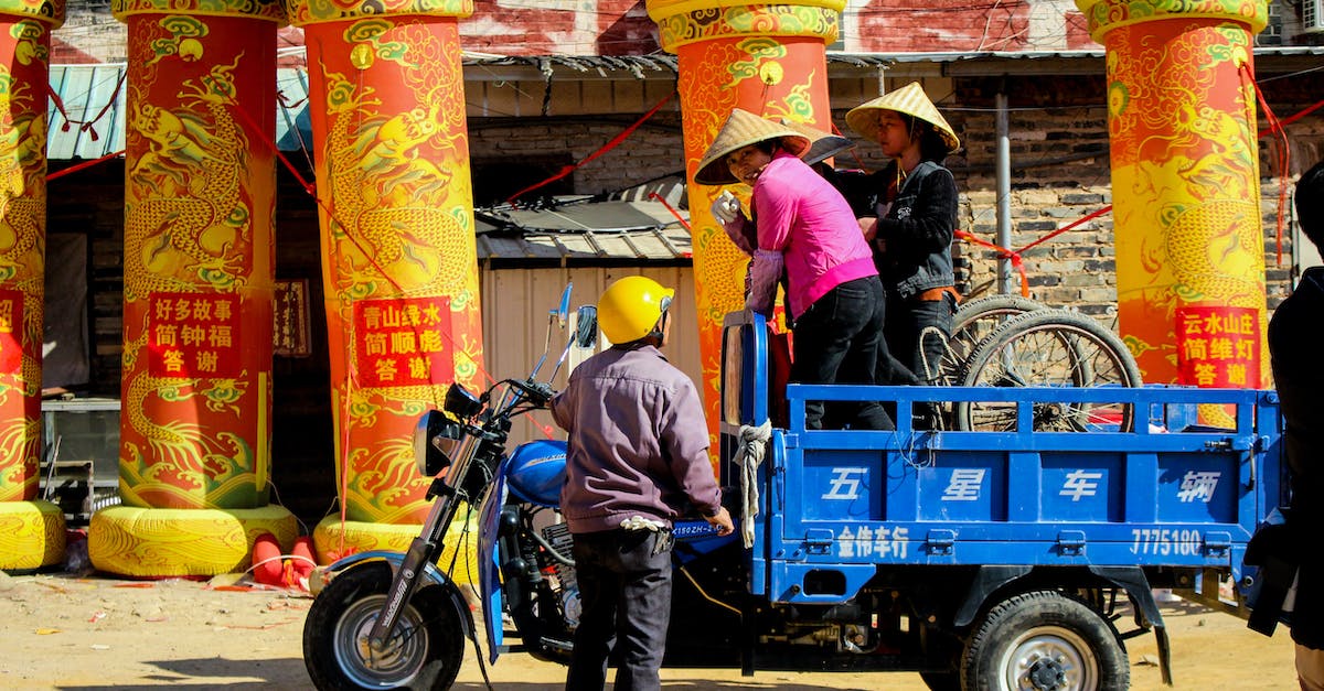 Villagers disappeared - Man in Black Jacket and Blue Denim Jeans Riding Blue Motorcycle