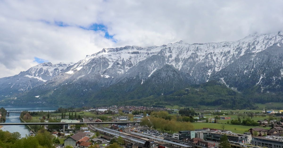 Villagers disappeared - A Town Near Snow Covered Mountains Under Blue Sky