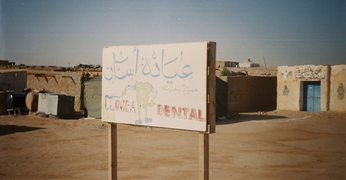 Villages on "Old" Worlds? - Weathered Dentist Sign in Desert Village