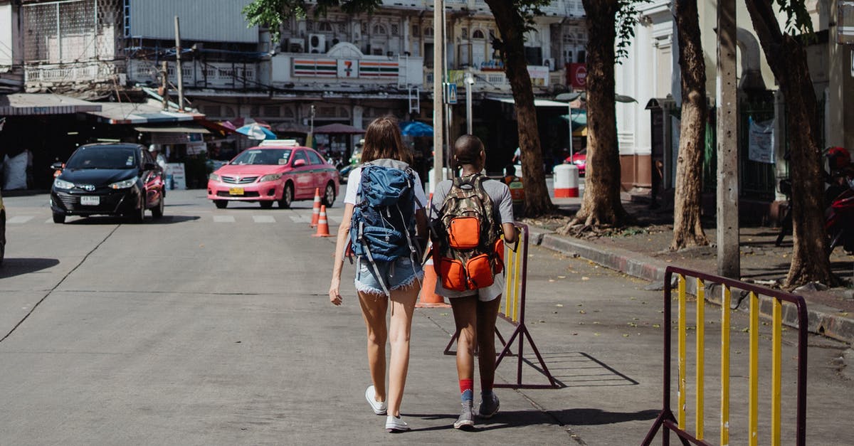 Wages maxed out at $25 - Woman in Blue Denim Jacket and Blue Denim Shorts Walking on Street Wages maxed out at $25 - Woman in Blue Denim Jacket and Blue Denim Shorts Walking on Street
