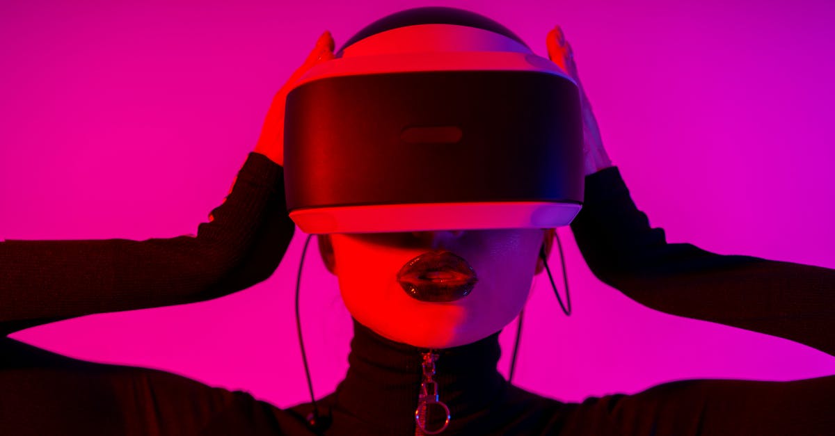 Warcraft 3 LAN Game discovery - Astonished young female using virtual reality goggles while experiencing invisible reality on pink background Warcraft 3 LAN Game discovery - Astonished young female using virtual reality goggles while experiencing invisible reality on pink background