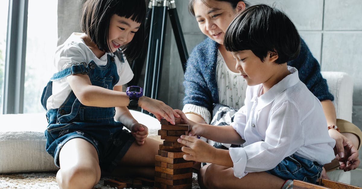 Warning when installing relatively old game - Full body of happy ethnic children sitting on floor and playing tower game while spending weekend with grandmother Warning when installing relatively old game - Full body of happy ethnic children sitting on floor and playing tower game while spending weekend with grandmother