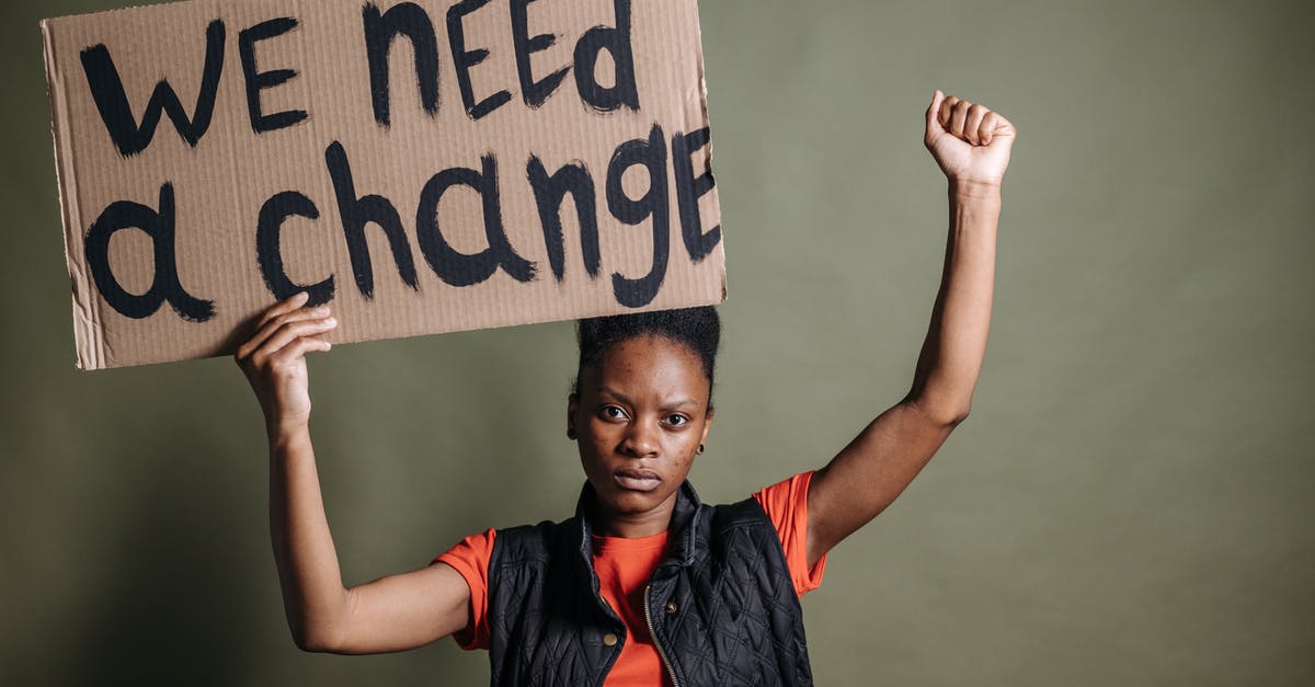 We have never been told what the ECHO acronym means, right? - A Woman Holding a Placard
