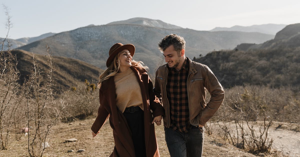 Weapon-Range: How does it affect gameplay? - Man and Woman Standing on Brown Field Weapon-Range: How does it affect gameplay? - Man and Woman Standing on Brown Field