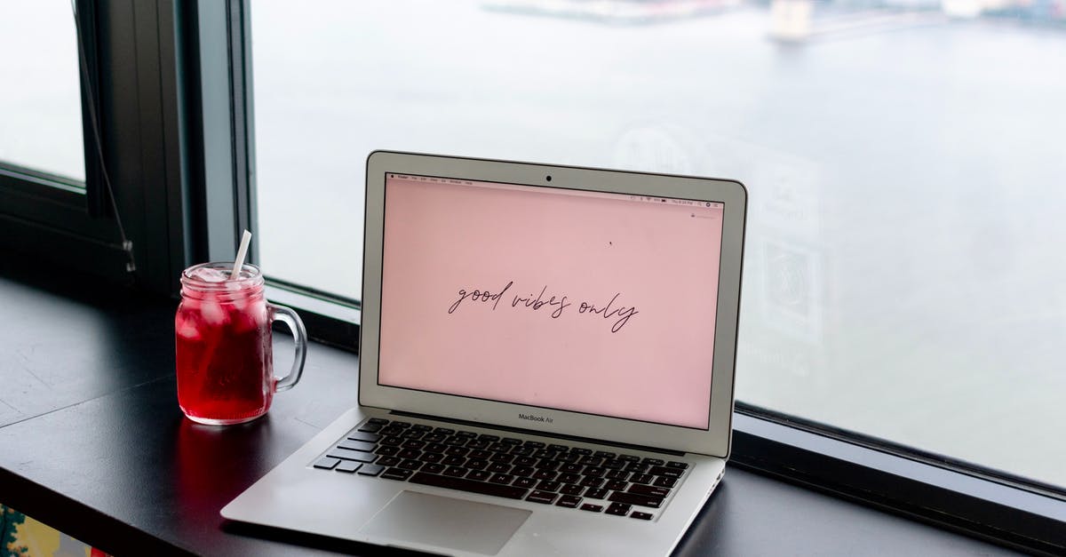 Weird pixels on the title screen on Windows 10 - Laptop with title near refreshing drink on windowsill in cafeteria Weird pixels on the title screen on Windows 10 - Laptop with title near refreshing drink on windowsill in cafeteria