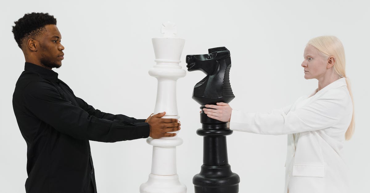 What's a good tactic to defeat Giant Piranhas? - Man and Woman Holding a Giant Chess Piece What's a good tactic to defeat Giant Piranhas? - Man and Woman Holding a Giant Chess Piece