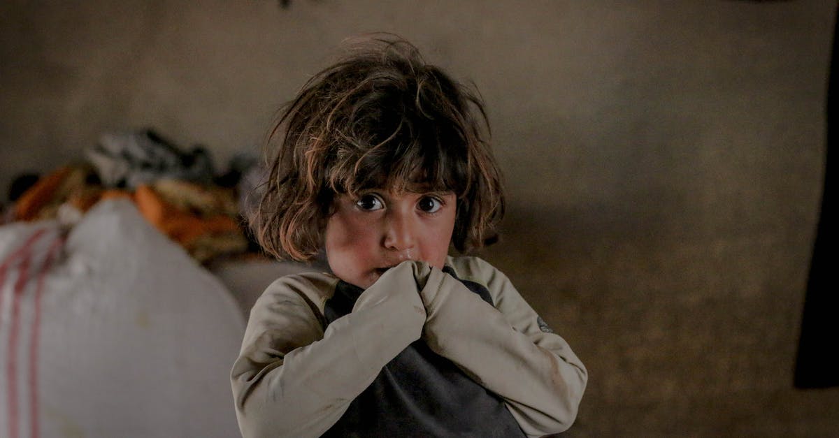 What's the benefit of destroying abandoned dwellings? - Scared kid looking at camera What's the benefit of destroying abandoned dwellings? - Scared kid looking at camera