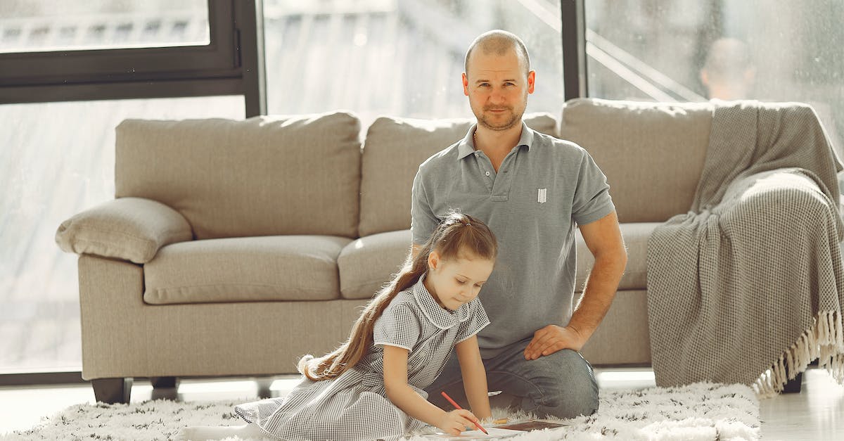 What's the best room to assign dwellers to? - Man in Grey Polo Shirt Sitting Beside Girl in Grey Checked Dress