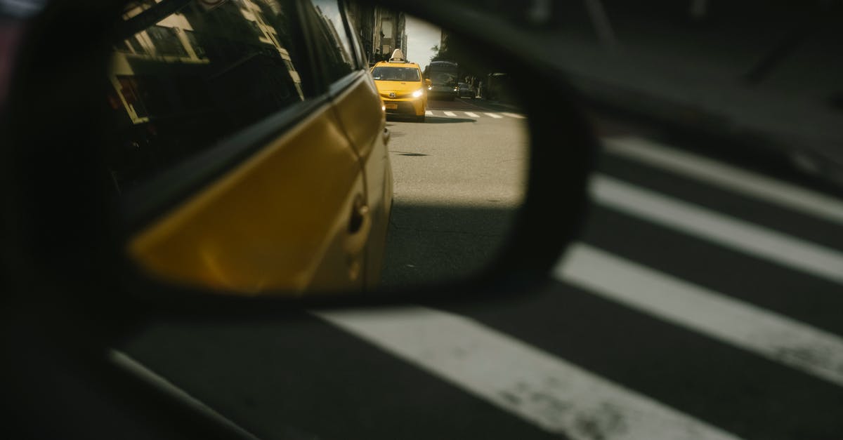What's the best route to all targets on R&D side mission? - Modern taxi cars driving on road with crosswalk