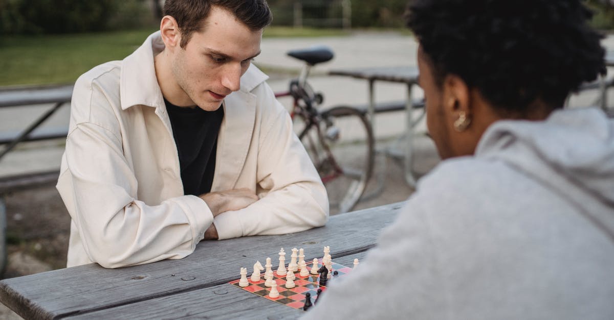 What's the best strategy for deploying ascensions for planets in Stellaris? - Concentrated young guy in casual clothes thinking while playing chess game with anonymous African American male friend in park