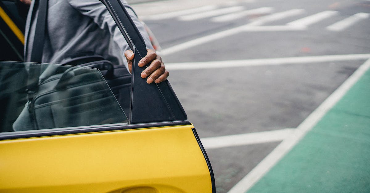 What's the best way to get rich? - Black man opening door of yellow car