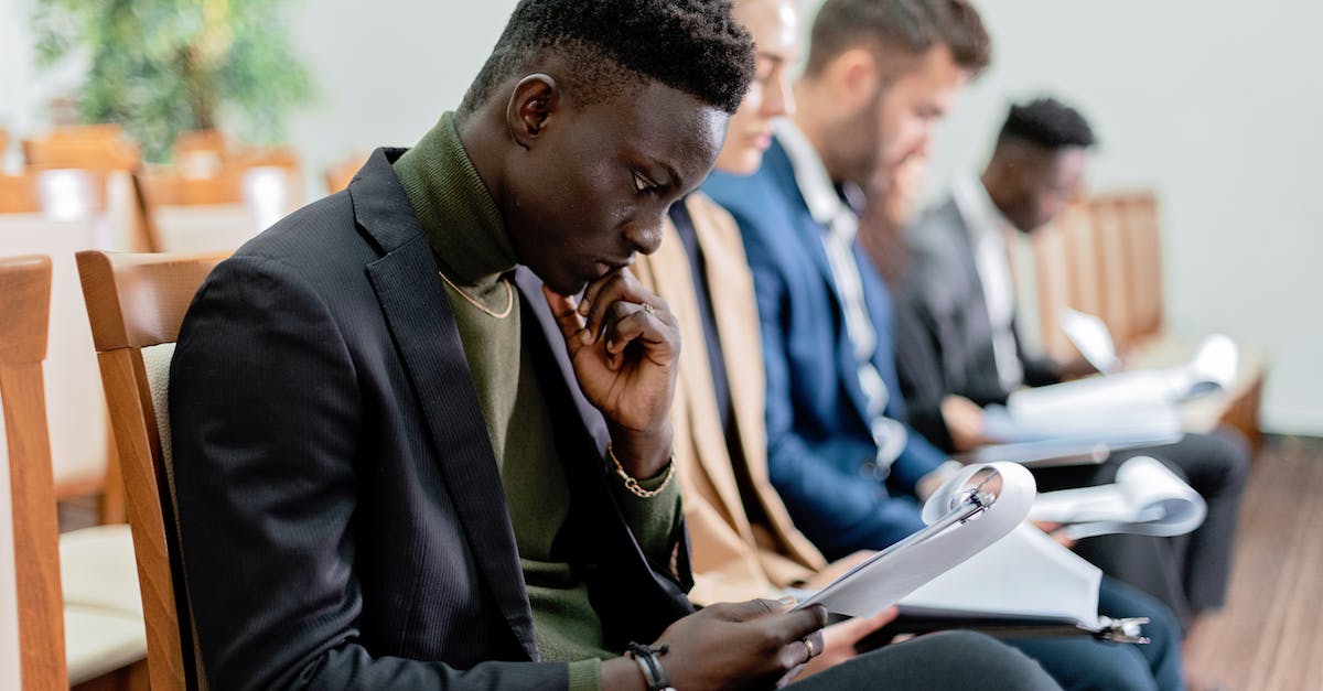 What's the deal with the rat king? - Man in Black Suit Jacket Holding Smartphone
