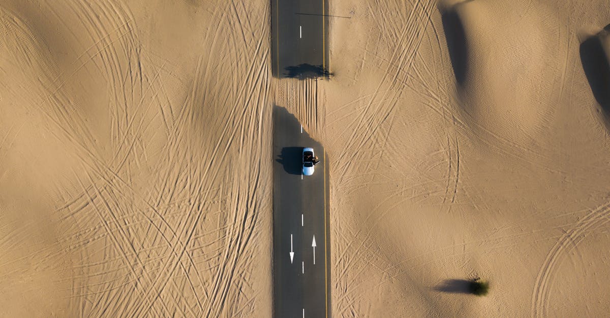 What's the difference between getting the High Road or Low Road during the Marla mission? - Bird's Eye Photography of Road in Middle of Dessert