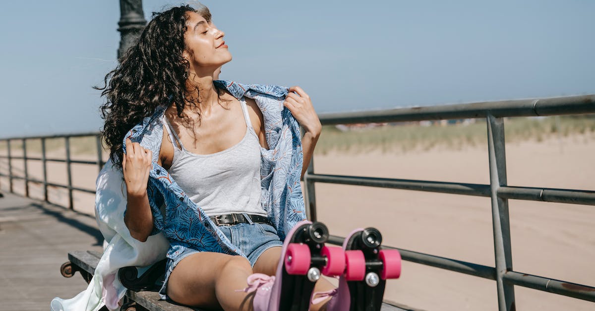 What's the down button do in Second Son? - Woman in Tank Top and Button Down Shirt Sitting on a Bench What's the down button do in Second Son? - Woman in Tank Top and Button Down Shirt Sitting on a Bench