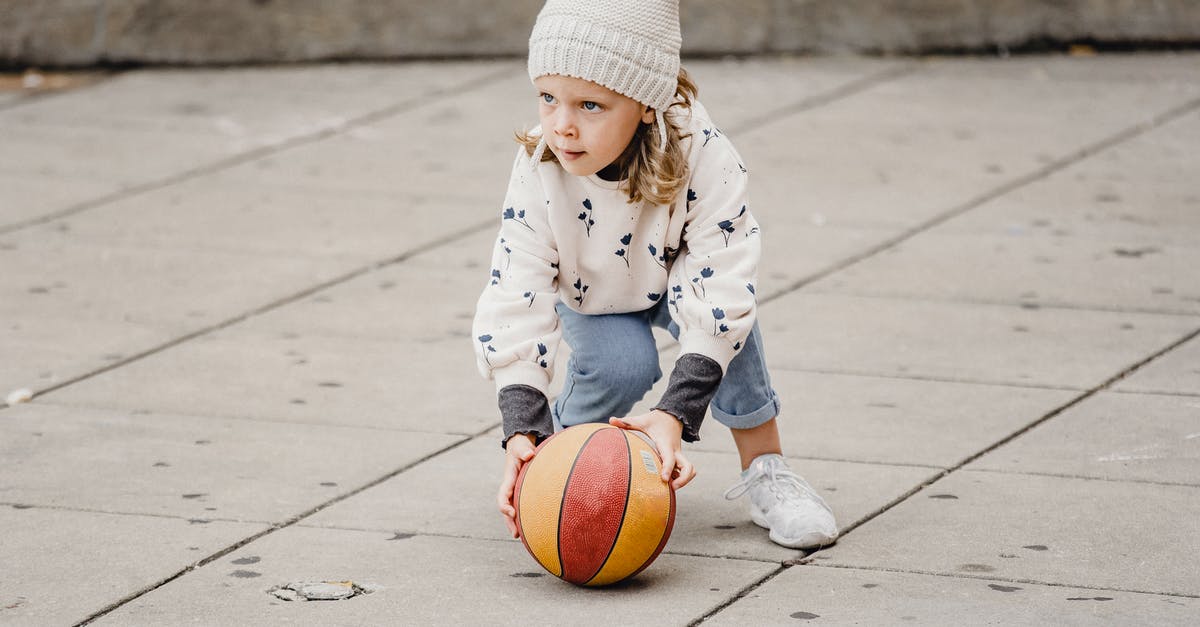 What's the genre of game where you have to look after a community that grows in real time? - Girl playing with ball on street What's the genre of game where you have to look after a community that grows in real time? - Girl playing with ball on street