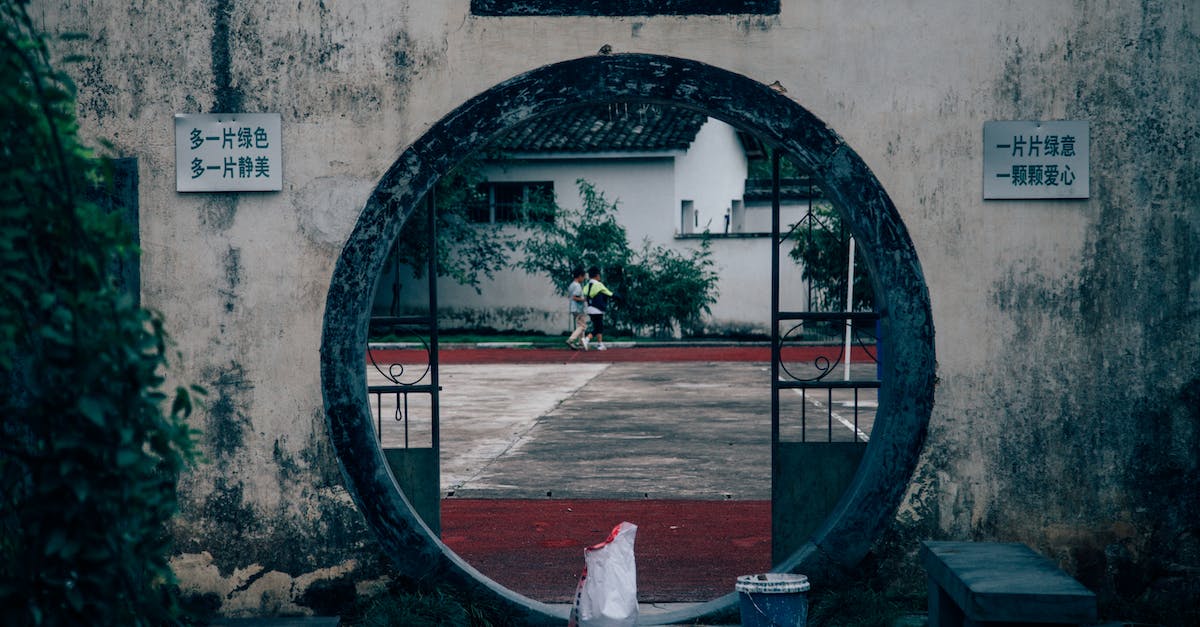 What's the maximum amount of damage you can take to keep an A? - Back view of anonymous couple walking near aged house with dirty wall and inscriptions What's the maximum amount of damage you can take to keep an A? - Back view of anonymous couple walking near aged house with dirty wall and inscriptions