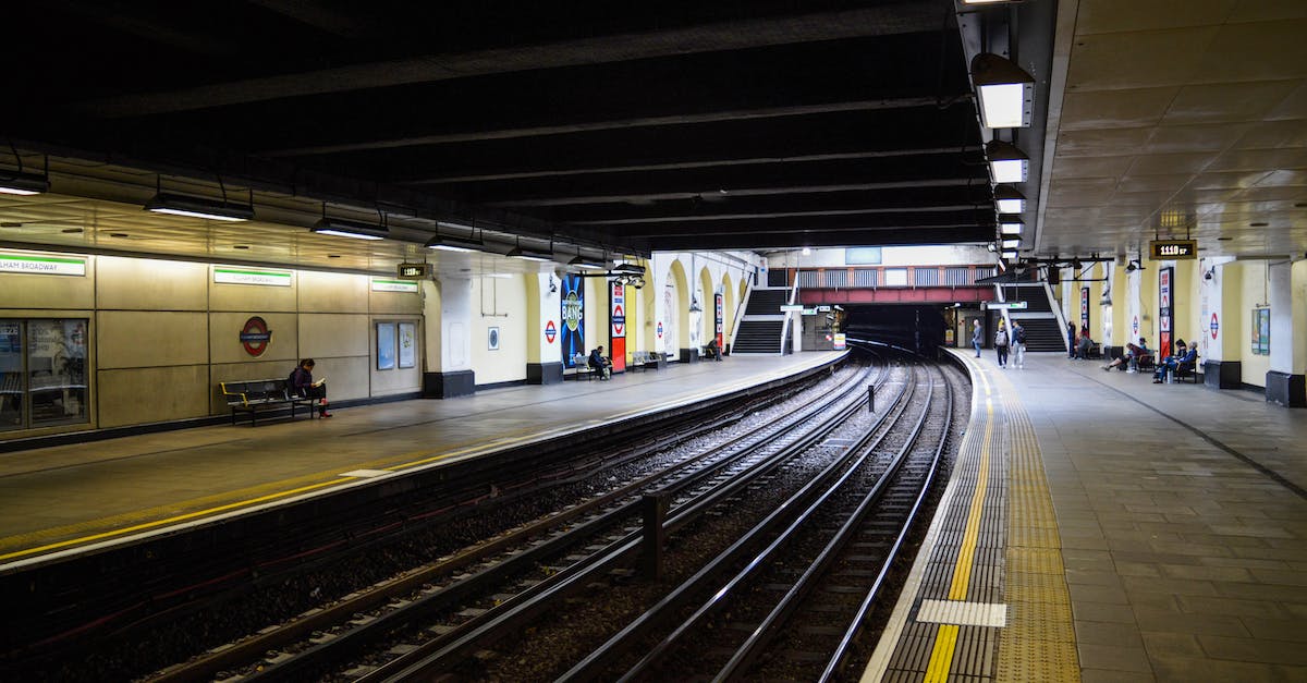 What's the most efficient way to travel with your lamp lit? - Concrete modern platform with benches columns and advertisements lighted with bright white illumination What's the most efficient way to travel with your lamp lit? - Concrete modern platform with benches columns and advertisements lighted with bright white illumination