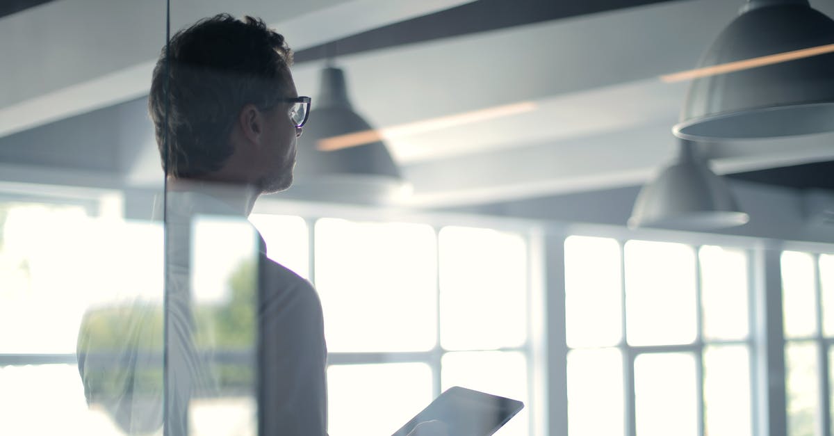 What's the point of Item Exchange event? - Formal man with tablet giving presentation in office