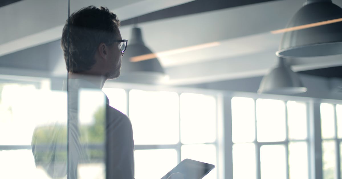 What's the point of upgrading this ability? - Formal man with tablet giving presentation in office What's the point of upgrading this ability? - Formal man with tablet giving presentation in office