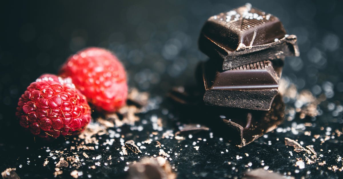 What's the proper name for the 'Food Bars' - Close-Up Photo Of Stacked Chocolates Bars Beside Raspberries