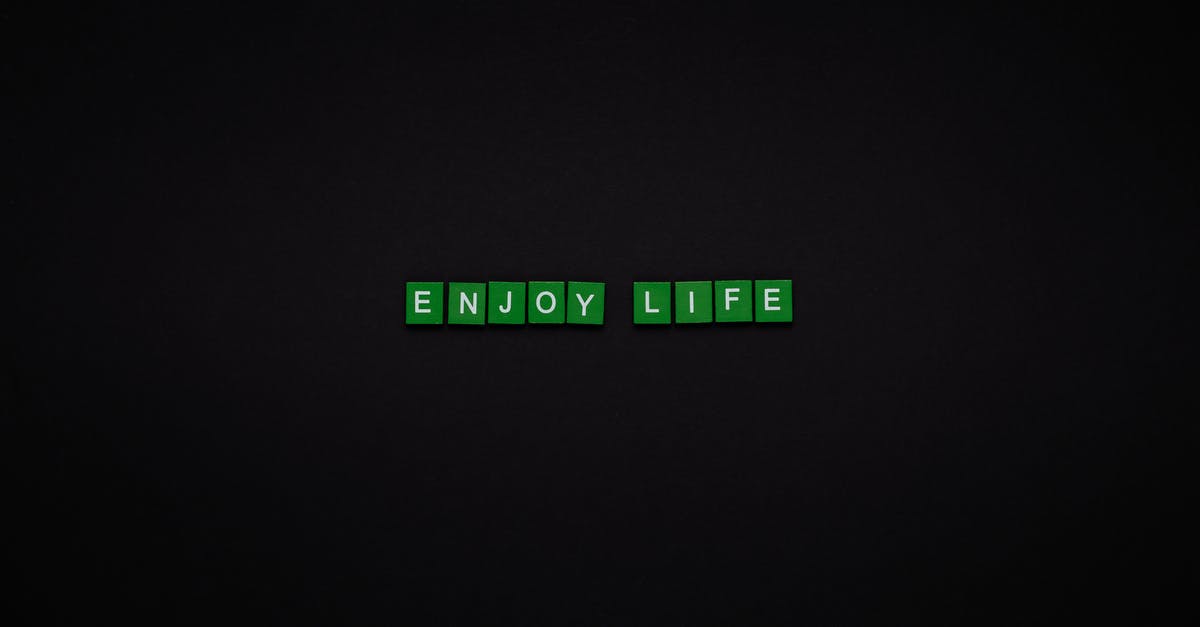 What's the time limit for turns in Words With Friends? - Enjoy Life Text On Green Tiles With Black Background