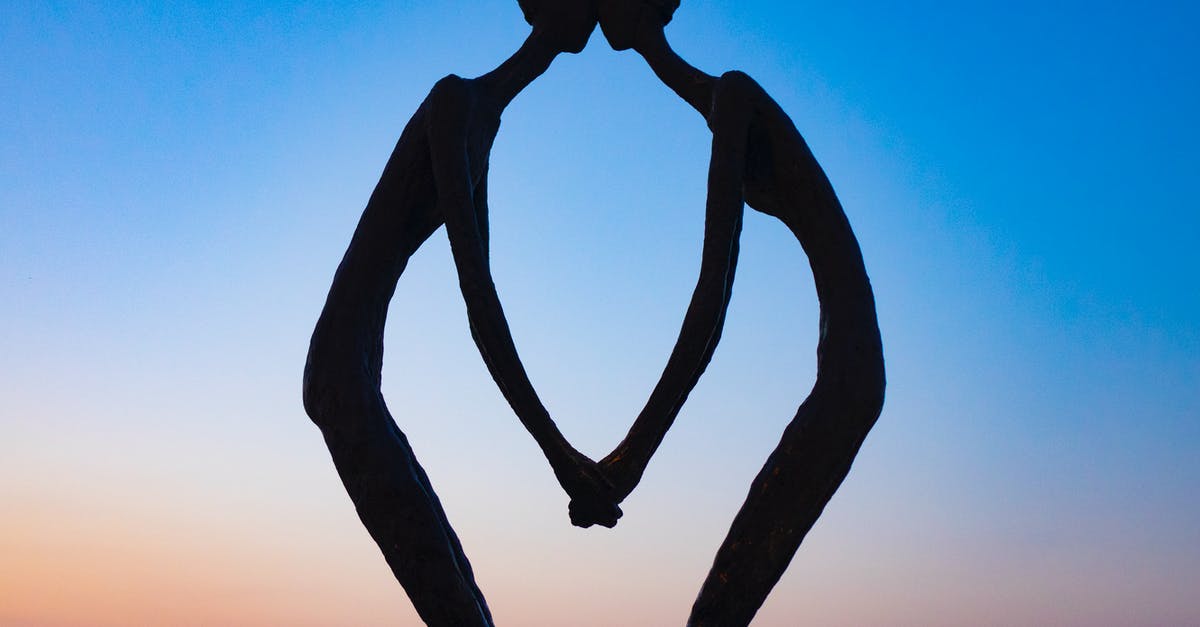 What's with the peaceful demonic statues in Dark Souls? - From below of silhouette of statue named First Love on background of sundown sky in Batumi