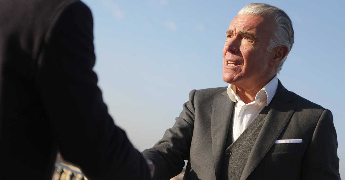 What abilities are available to a Leader from the Leader mod? - Elderly businessman shaking hands with partner