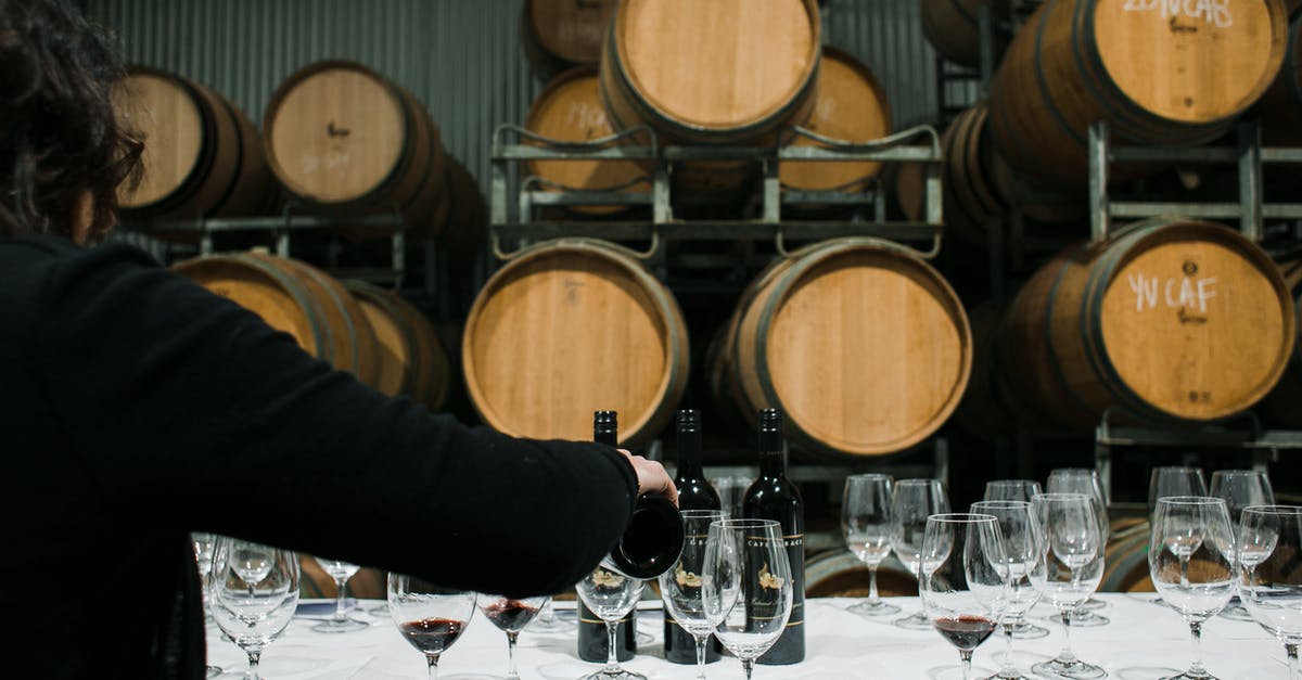 What affects how many quick attacks are needed to fill a charged attack? [duplicate] - Back view of anonymous sommelier pouring wine from bottle into wineglass while standing at table with glassware in winery against barrels