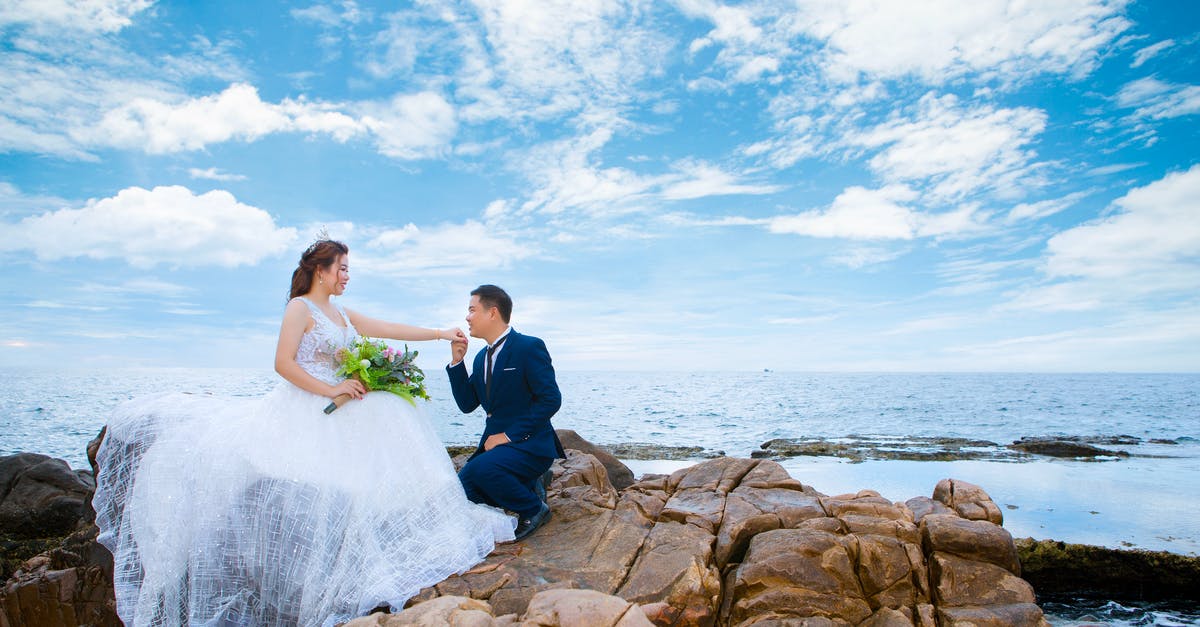 What affects your credit score in Endless Sky? - Newlywed couple on mount near sea on wedding day