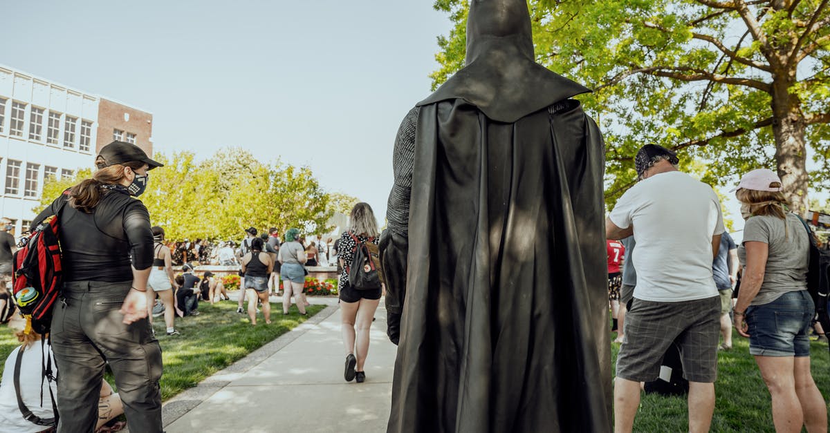 What algorithm determines when and where hero tokens appear? - Anonymous person in superhero costume walking in park