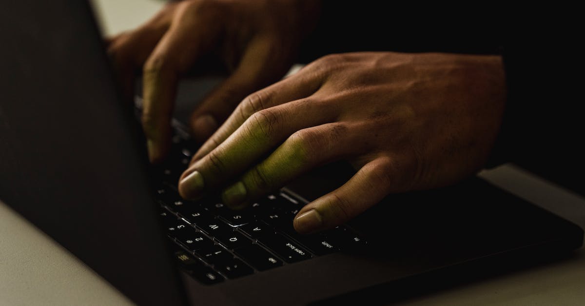 What application type and protocol do I use for port forwarding on 2WIRE? - Crop unrecognizable person typing on laptop keyboard