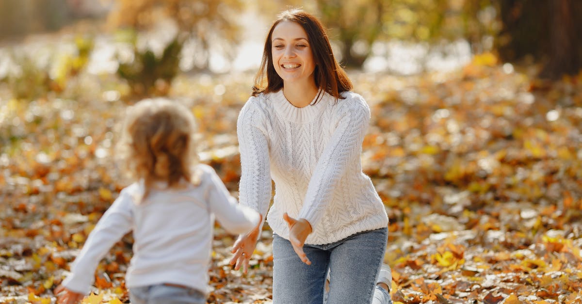 What are all the factors which affect catch chance? - Happy young mother and daughter having fun in autumnal park