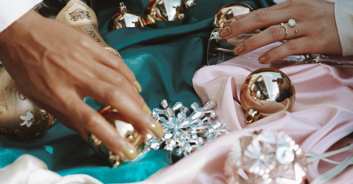 What are all the pokemon pearl ribbons? - Person Holding Silver and Gold Accessory