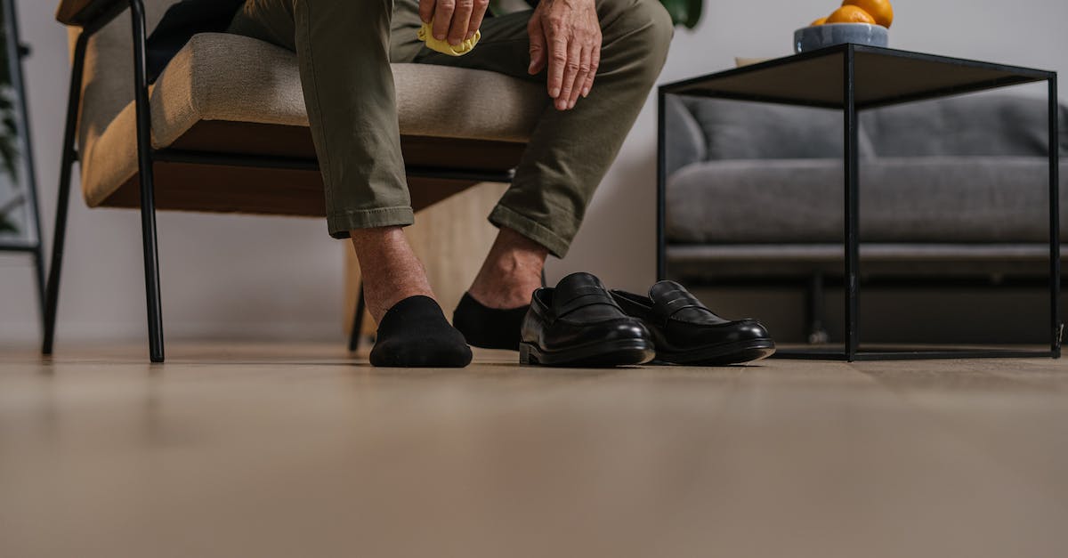 What are all the rewards for leveling up? - Man in Brown Pants and Black Shoes Sitting on Brown Sofa