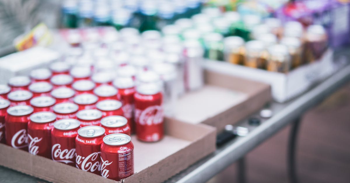 What are Boom Boxes and how can I get them on a regular basis? - Selective Focus Photography of Red Coca-cola Can Lot on Box
