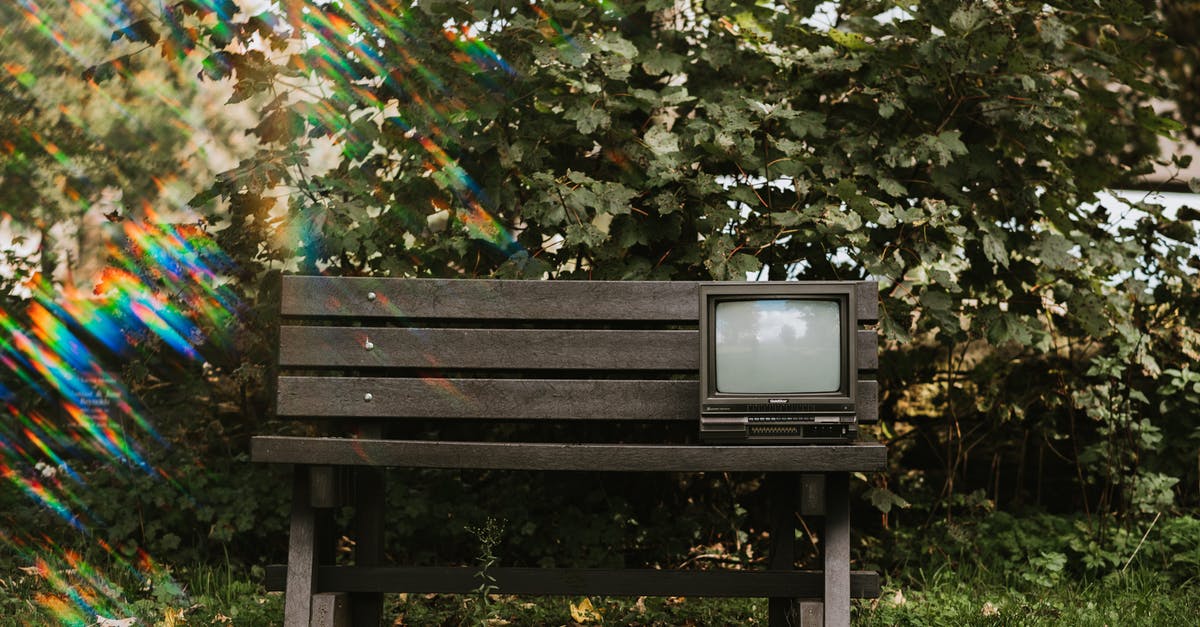 What are cost-effective uses of gems? - Vintage TV set on wooden bench