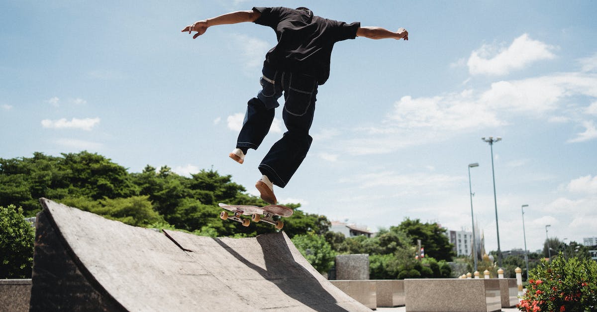What are Dynamic Shadows? - Unrecognizable skateboarder performing trick in air above ramp