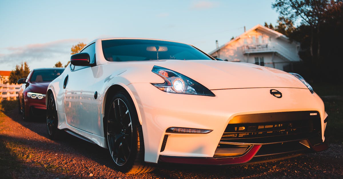 What are some of the ways to increase the Respectable quality? - Luxury white sports car with glowing headlights parked on rough road near small houses against blue sky in countryside