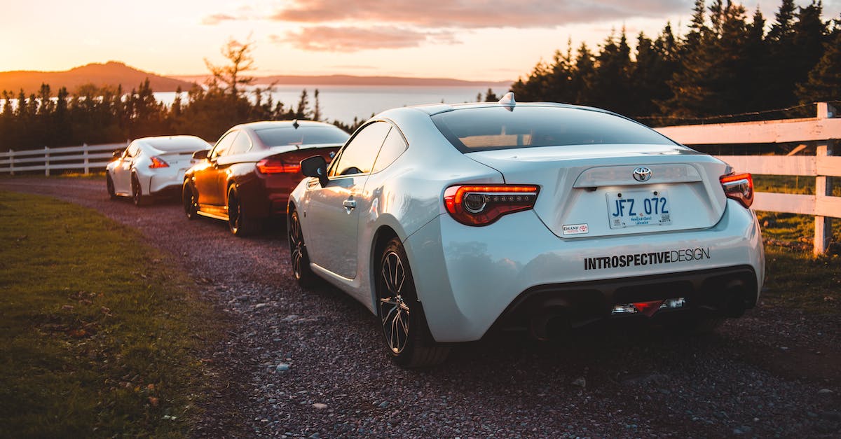 What are some of the ways to increase the Respectable quality? - Stylish coupe automobiles riding on rural hilly road near fir trees leading to lake against sundown sky