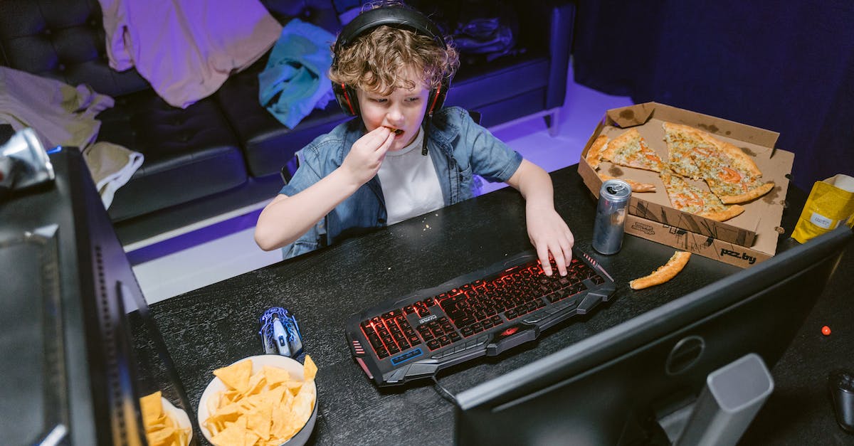 What are the advantages/disadvantages of having high mouse sensitivity in Moba games when playing skill-shot based characters? - High-Angle Shot of a Boy Playing Computer Video Game while Eating Pizza