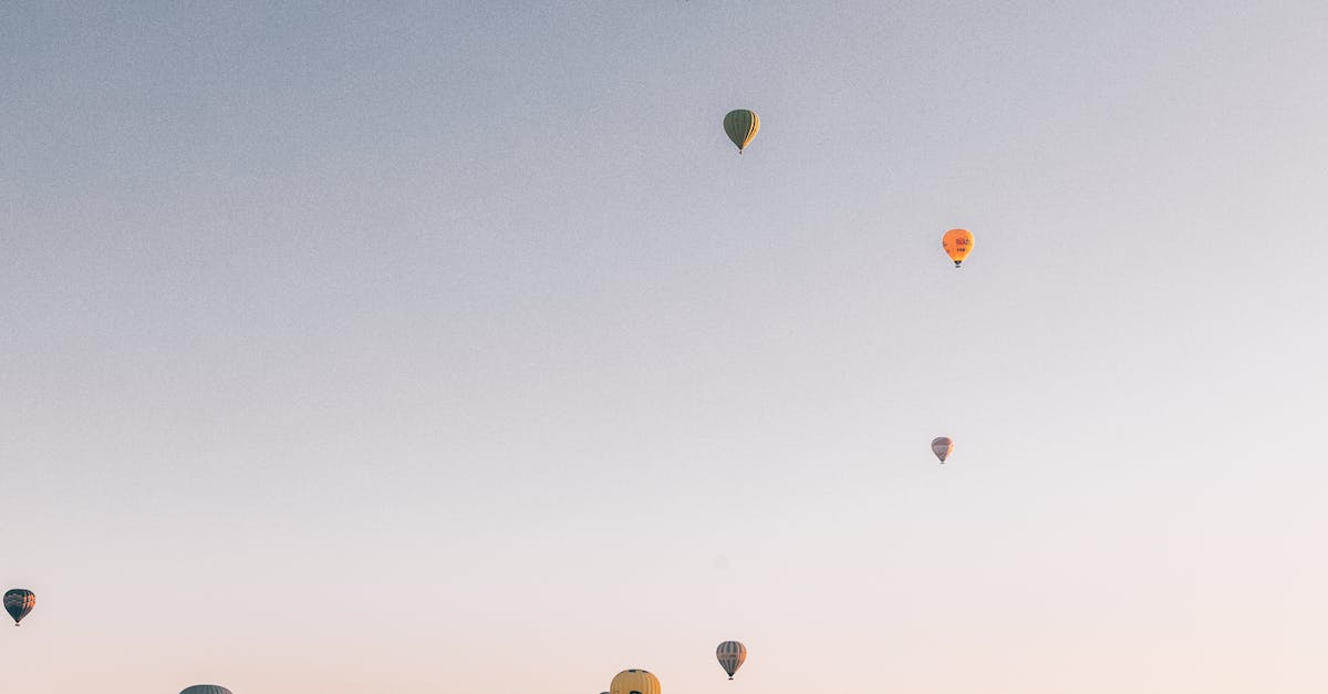 What are the altitudes for the various altitude record contracts? - Low angel of various colorful air balloons flying in cloudless sunset sky over rocky mountains