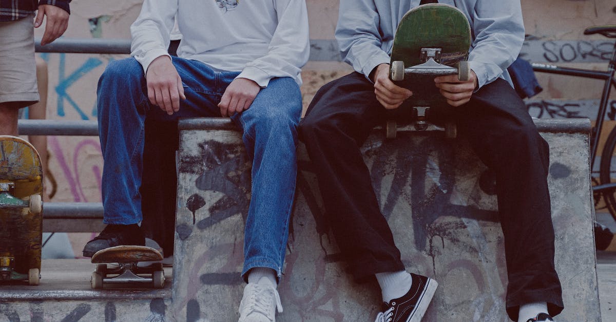 What are the benefits of legendary skills? - Man in White Long Sleeve Shirt and Blue Denim Jeans Sitting on Concrete Bench