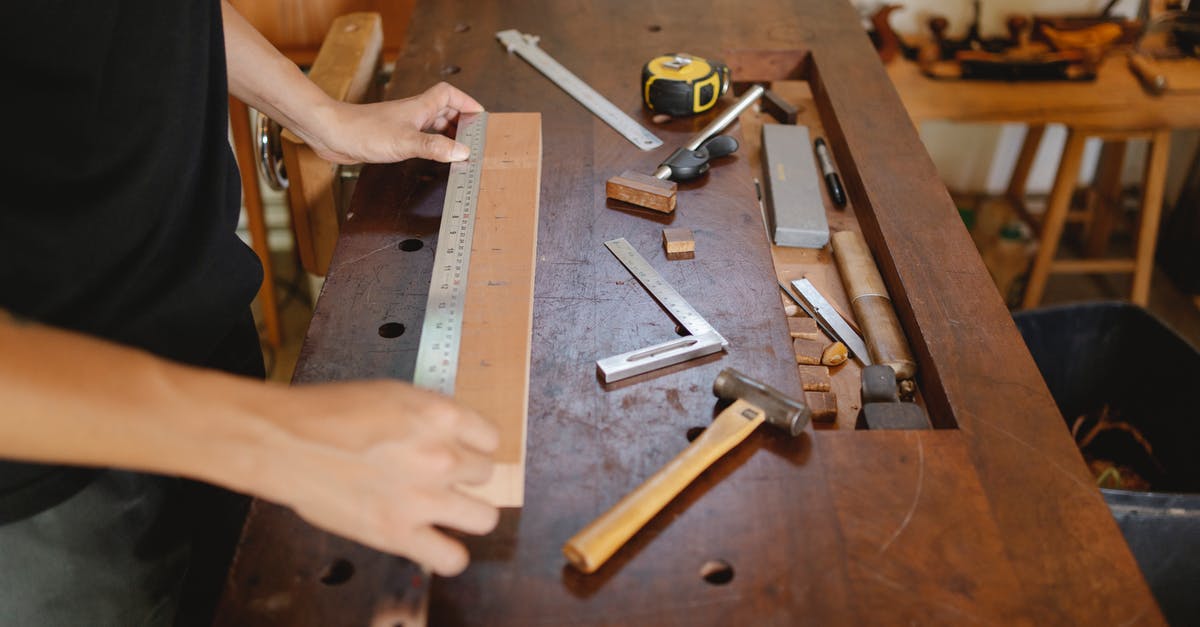 What are the benefits of using a better hammer in A Township Tale (VR)? - Man working with wood and ruler in carpentry studio What are the benefits of using a better hammer in A Township Tale (VR)? - Man working with wood and ruler in carpentry studio