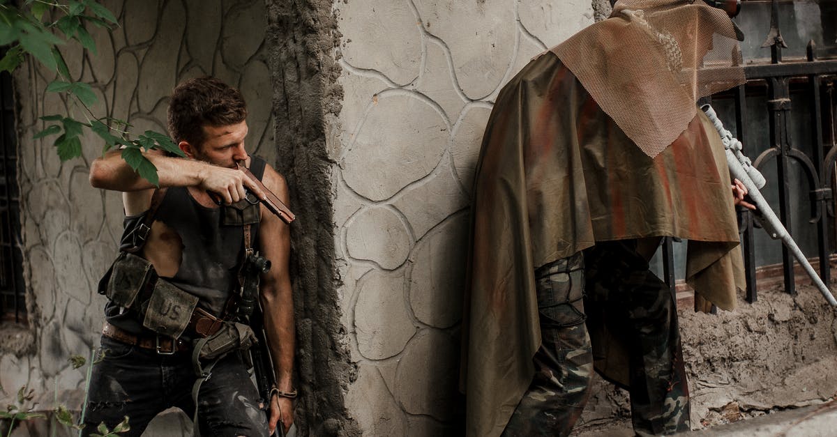 What are the best weapons for fighting The Destroyer? [duplicate] - Military Men Holding Guns Beside Concrete Corner