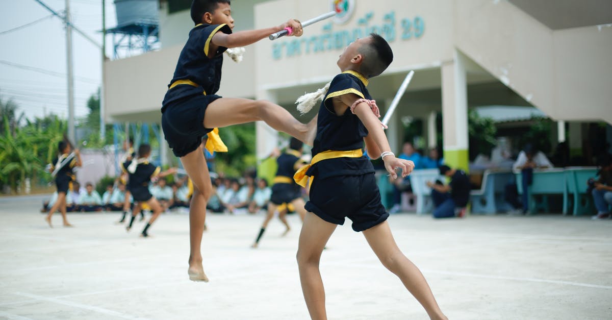 What are the best weapons for fighting The Destroyer? [duplicate] - Photography of a Boy Kicking Another Boy