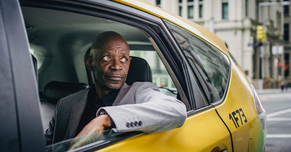 What are the bosses and when do they appear? - Black man in elegant coat in taxi What are the bosses and when do they appear? - Black man in elegant coat in taxi