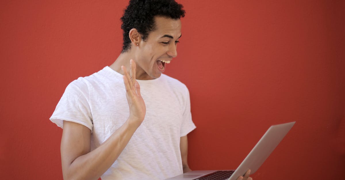 What are the buffs in this vanilla wow screenshot? - Cheerful man using laptop for video call What are the buffs in this vanilla wow screenshot? - Cheerful man using laptop for video call