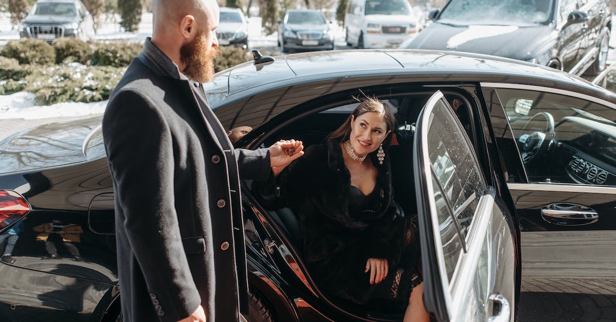 What are the closest systems in each major region to the Jita system? - Man in Black Suit Standing Beside Black Car
